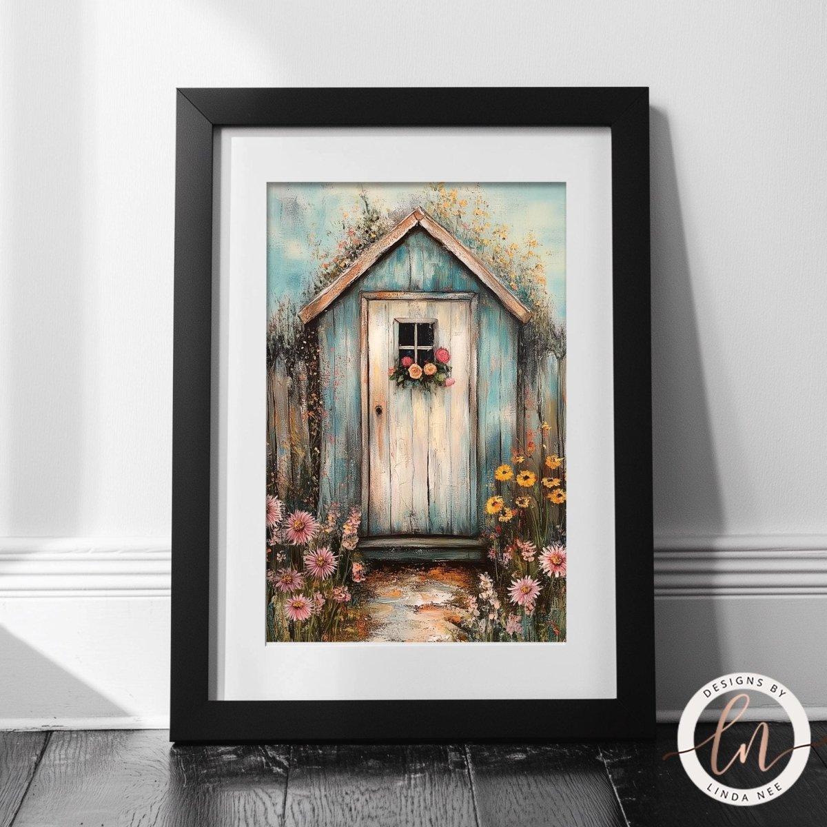 A framed painting depicting a quaint wooden shed surrounded by a vibrant garden filled with colorful flowers.