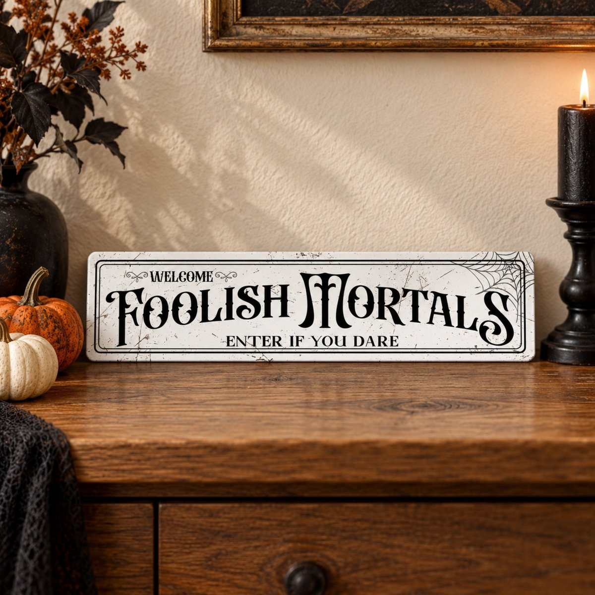 Enter If You Dare haunted house sign on a wooden table