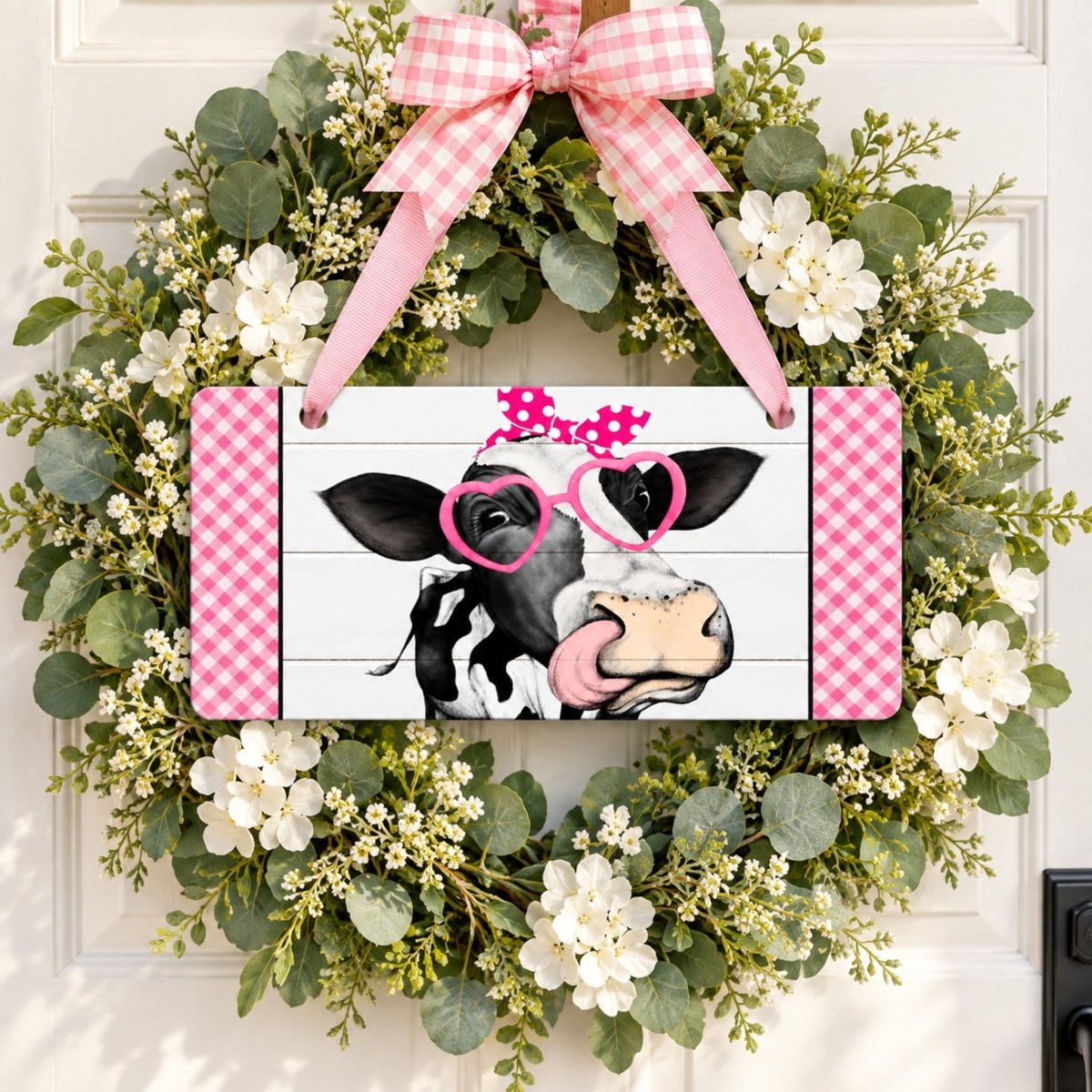Pink Heifer sign centered in a door wreath