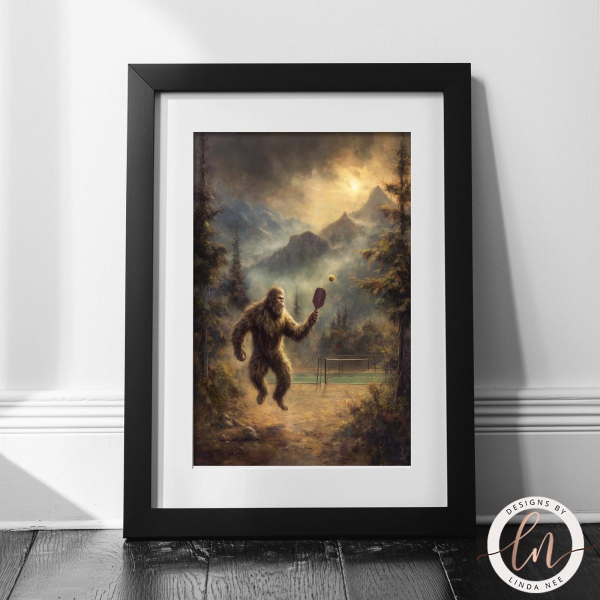 A framed painting depicting a large, furry creature, possibly a Sasquatch, playing tennis in a forest setting with mountains in the background.