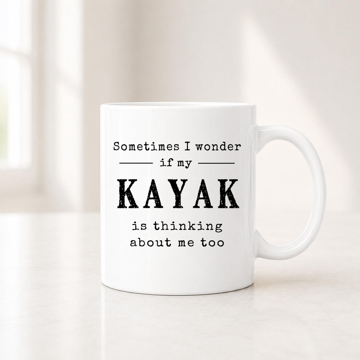 Second view of the white kayak mug showing the black quote about wondering if my kayak is thinking about me