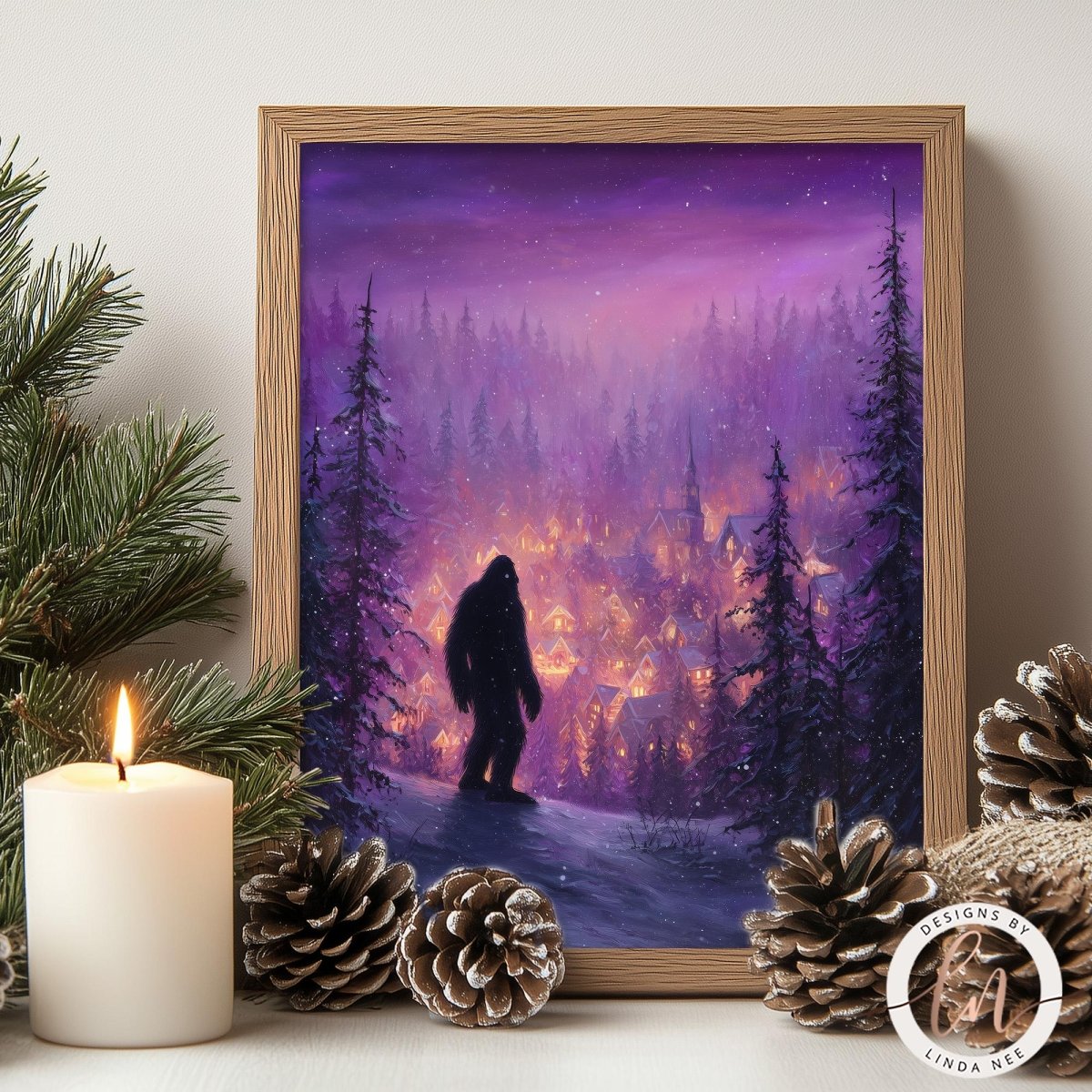 a painting of a silhouetted figure standing in a snowy forest at night, with a village in the background illuminated by lights. The painting is framed and displayed on a shelf, surrounded by pine cones and a lit candle.