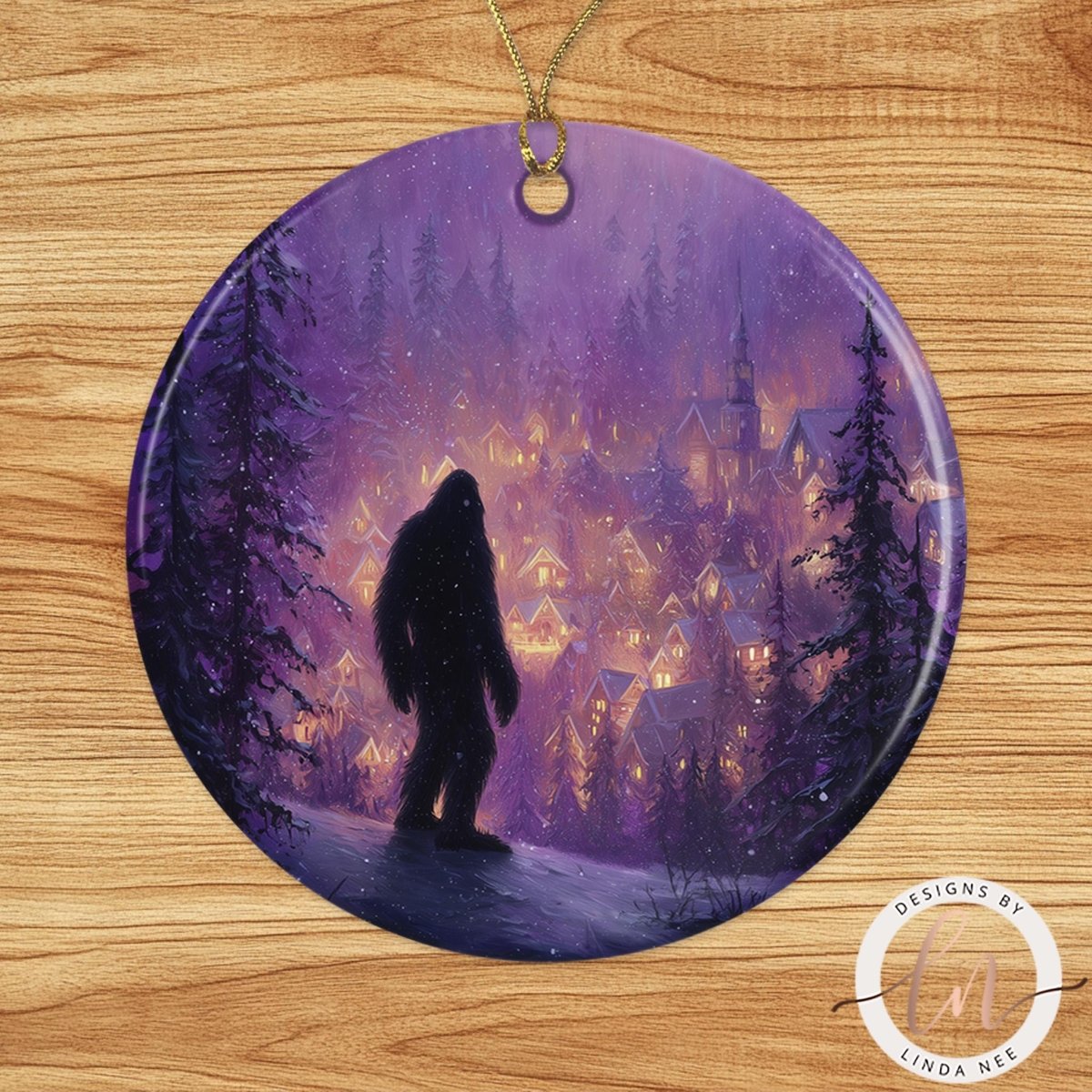 A silhouetted figure of a Sasquatch stands in a snowy village scene, with a purple and blue night sky and houses in the background.