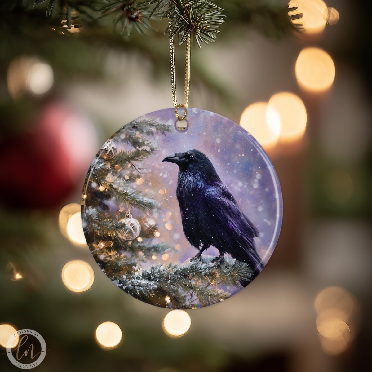 A black bird is perched on a branch of a Christmas tree, with a snowy background and twinkling lights in the background.