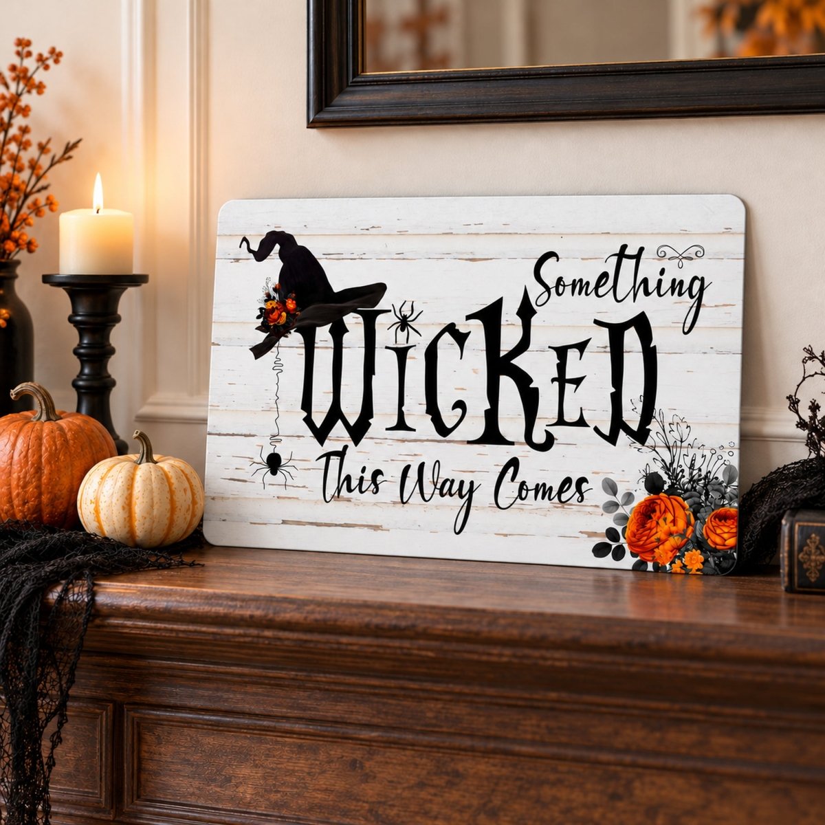 Something Wicked This Way Comes sign on a wood surface with a candle and pumpkins