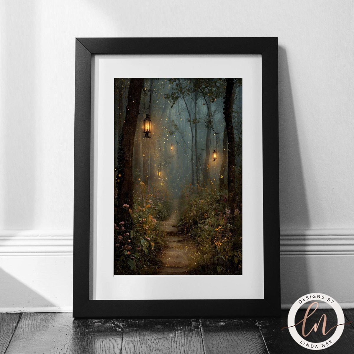A framed painting depicting a serene forest path with lanterns hanging from the trees, creating a mystical and enchanting atmosphere.