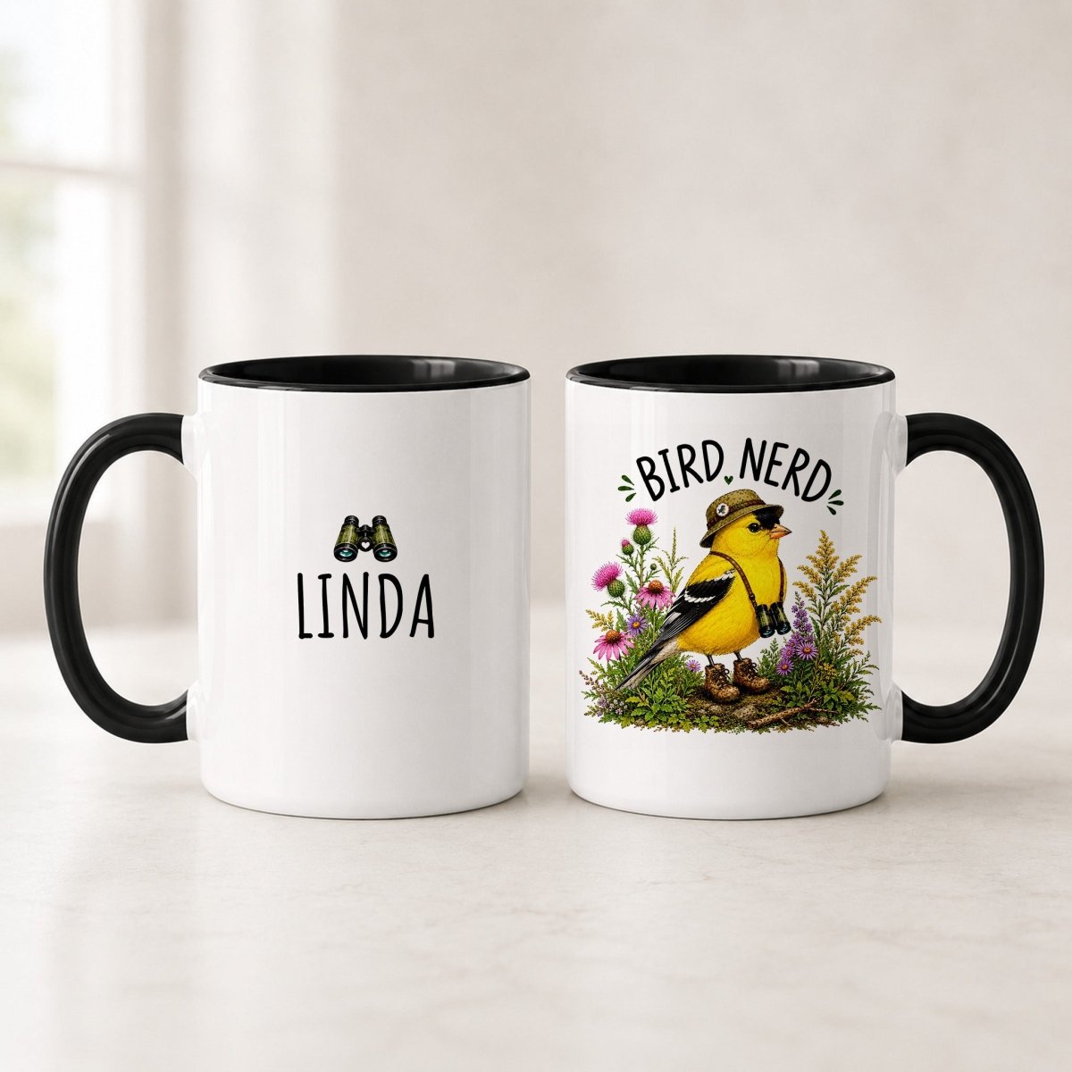 Black handle American Goldfinch Bird Nerd mugs showing the name LINDA under binoculars and the yellow bird