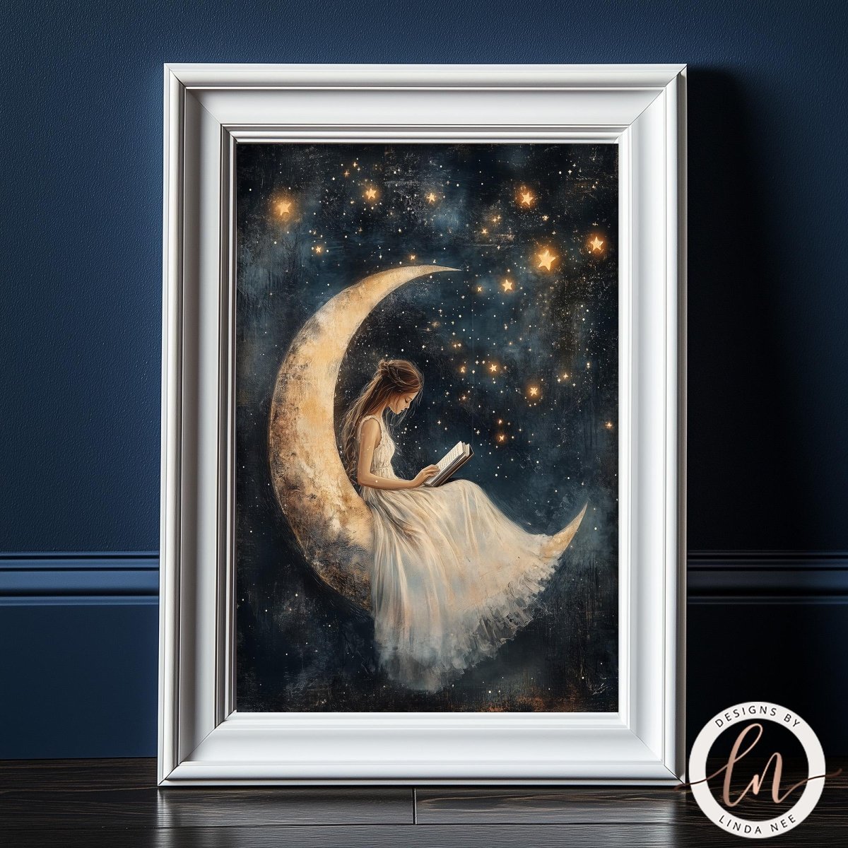 A framed painting depicting a woman sitting on a crescent moon, reading a book, with a starry night sky in the background.