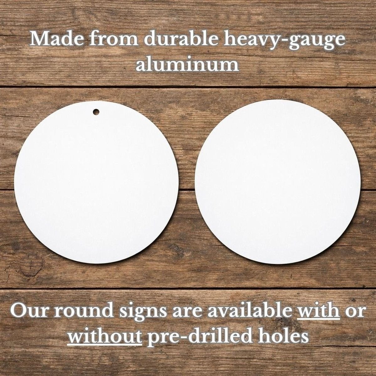 two white round signs, one with a hole in the center and the other without a hole, placed on a wooden surface.