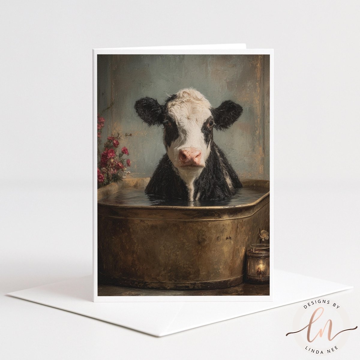 A black and white cow is sitting in a metal tub filled with water, surrounded by pink flowers.