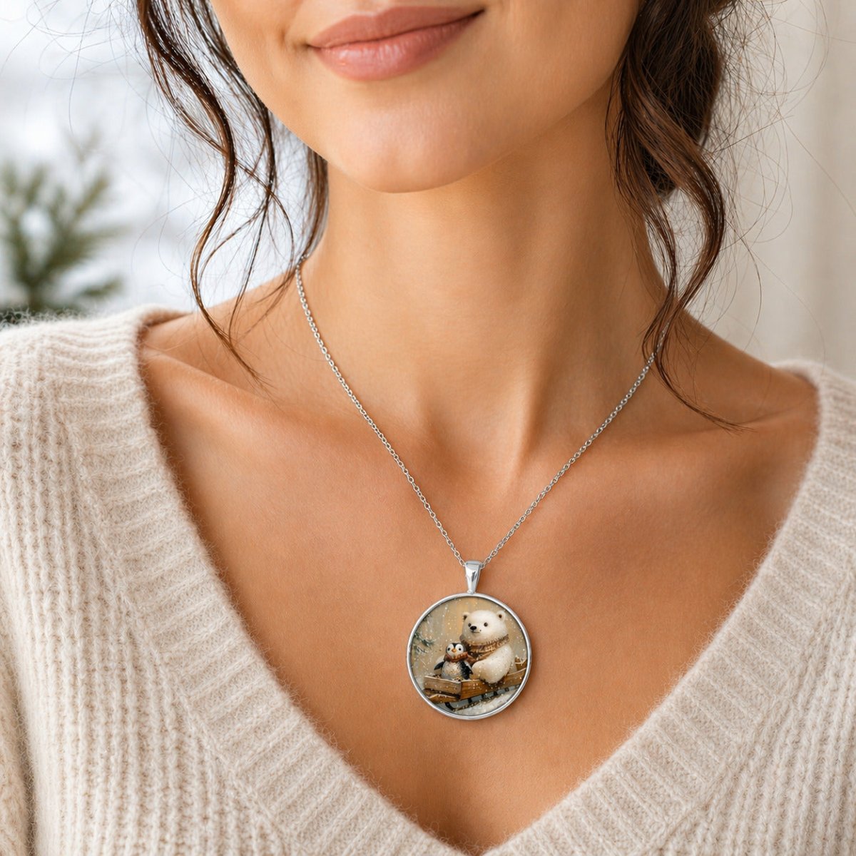 A woman wearing a necklace with a pendant featuring a bear and a penguin.