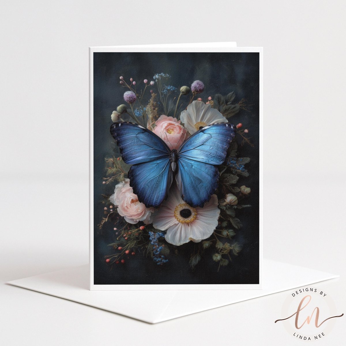 A card featuring a blue butterfly resting on a floral arrangement, with various flowers and foliage surrounding the butterfly.