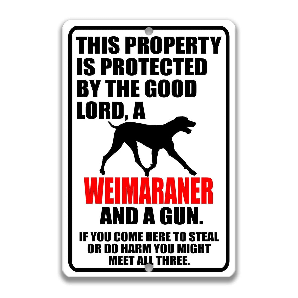 a sign with a warning about a property being protected by a good Lord, specifically a Weimaraner, and a gun. The sign also includes a cautionary message about potential theft or harm if someone comes to steal or harm the property.