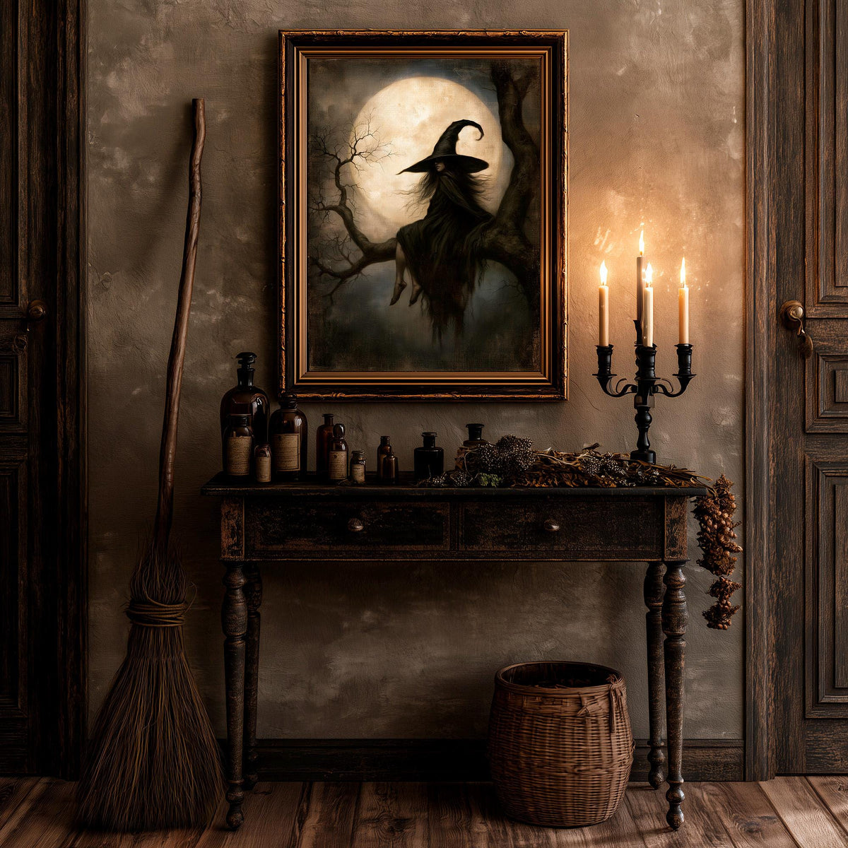 Witchcore wall art above a table set with a broom and lit candles
