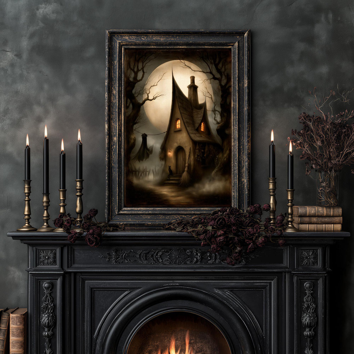 Witch cottage art print above a fireplace lit by tapered candles