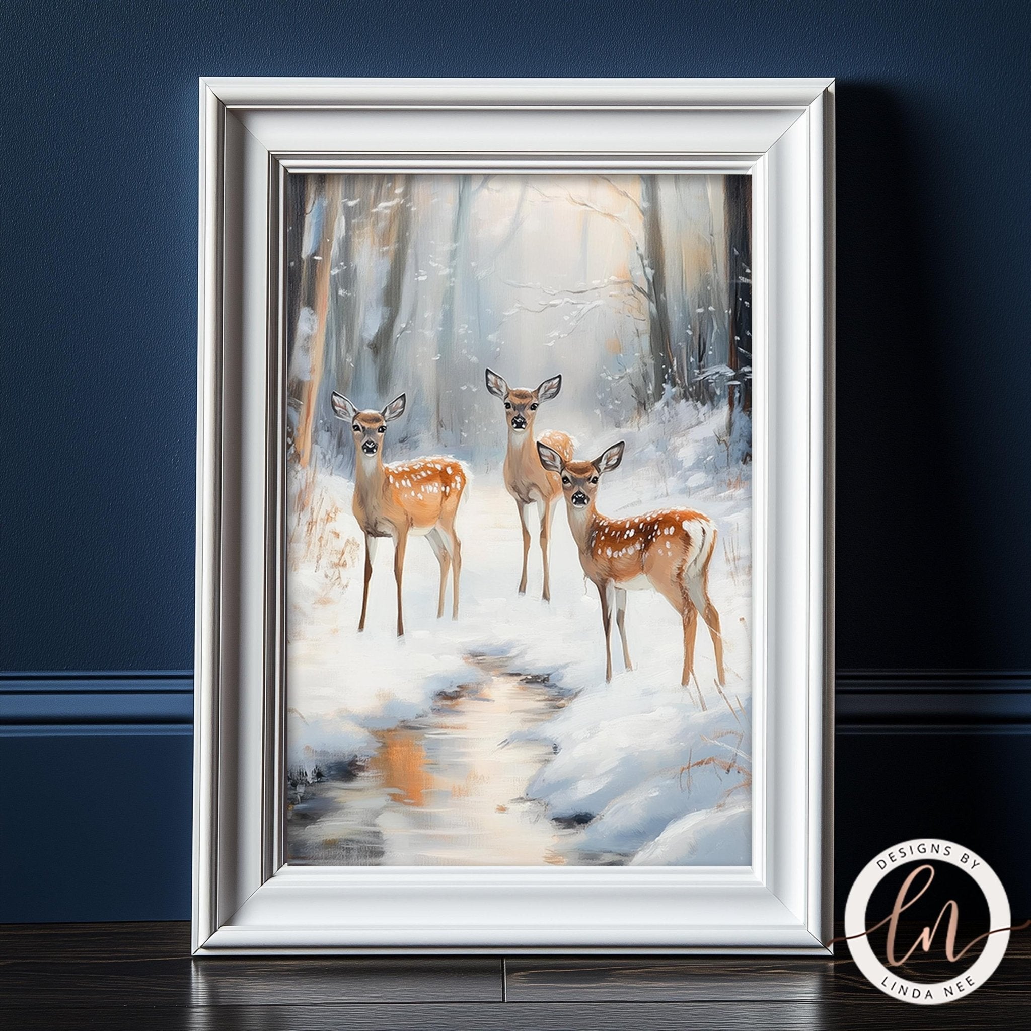 A framed painting depicting three deer standing in a snowy forest, with a stream running through the center of the scene.