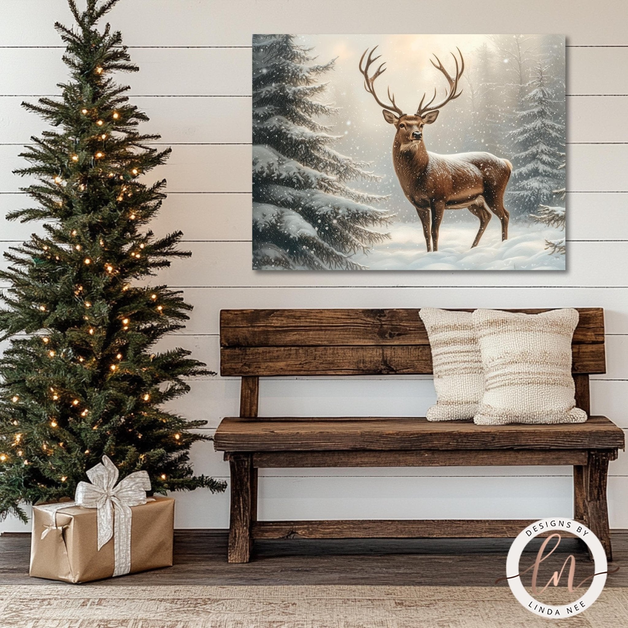 a wooden bench with two pillows, a Christmas tree with lights, and a painting of a deer in a snowy forest.