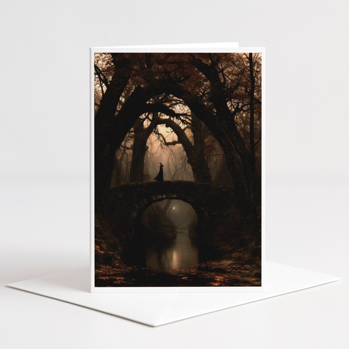 Witch standing on an old stone bridge beneath twisted autumn trees, gothic Halloween note card art