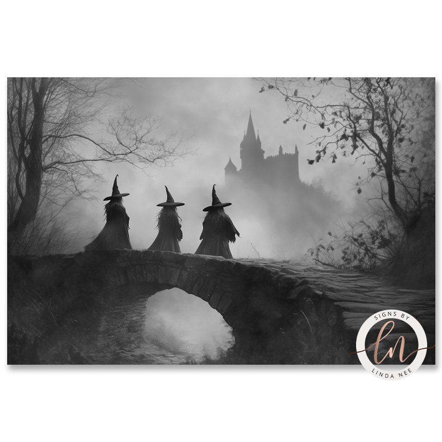 Three witches in pointed hats are walking across a stone bridge in a foggy, misty landscape with a castle in the background.