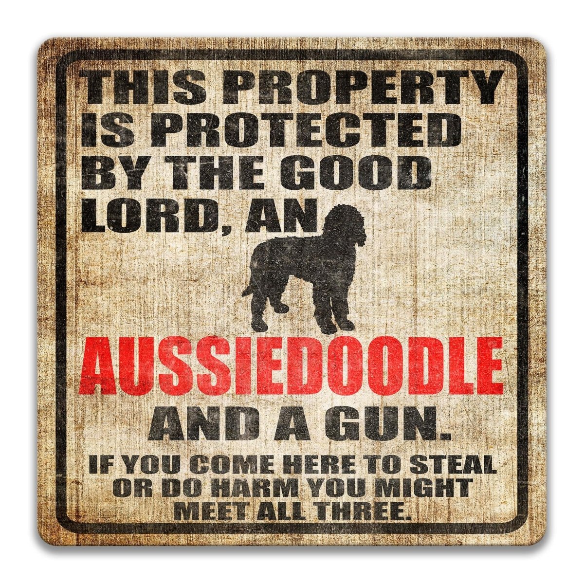 The image is a sign that reads "This property is protected by the good Lord, an Aussiedoodle and a gun. If you come here to steal or do harm, you might meet all three."