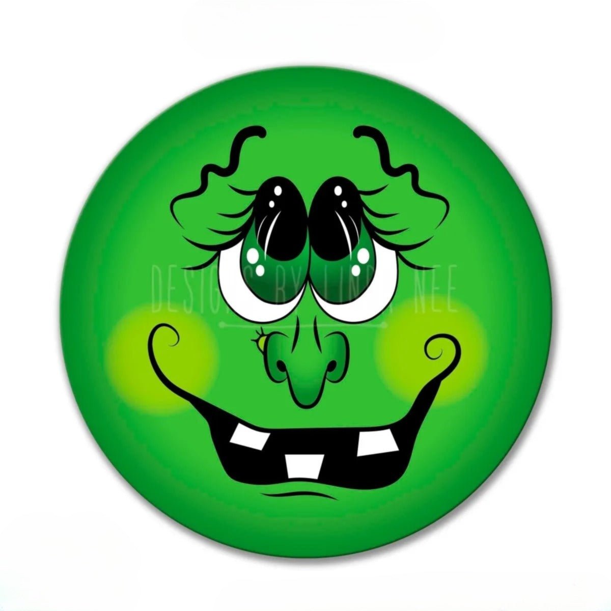 A green, cartoonish face with large eyes, a big nose, and a wide, toothy grin.
