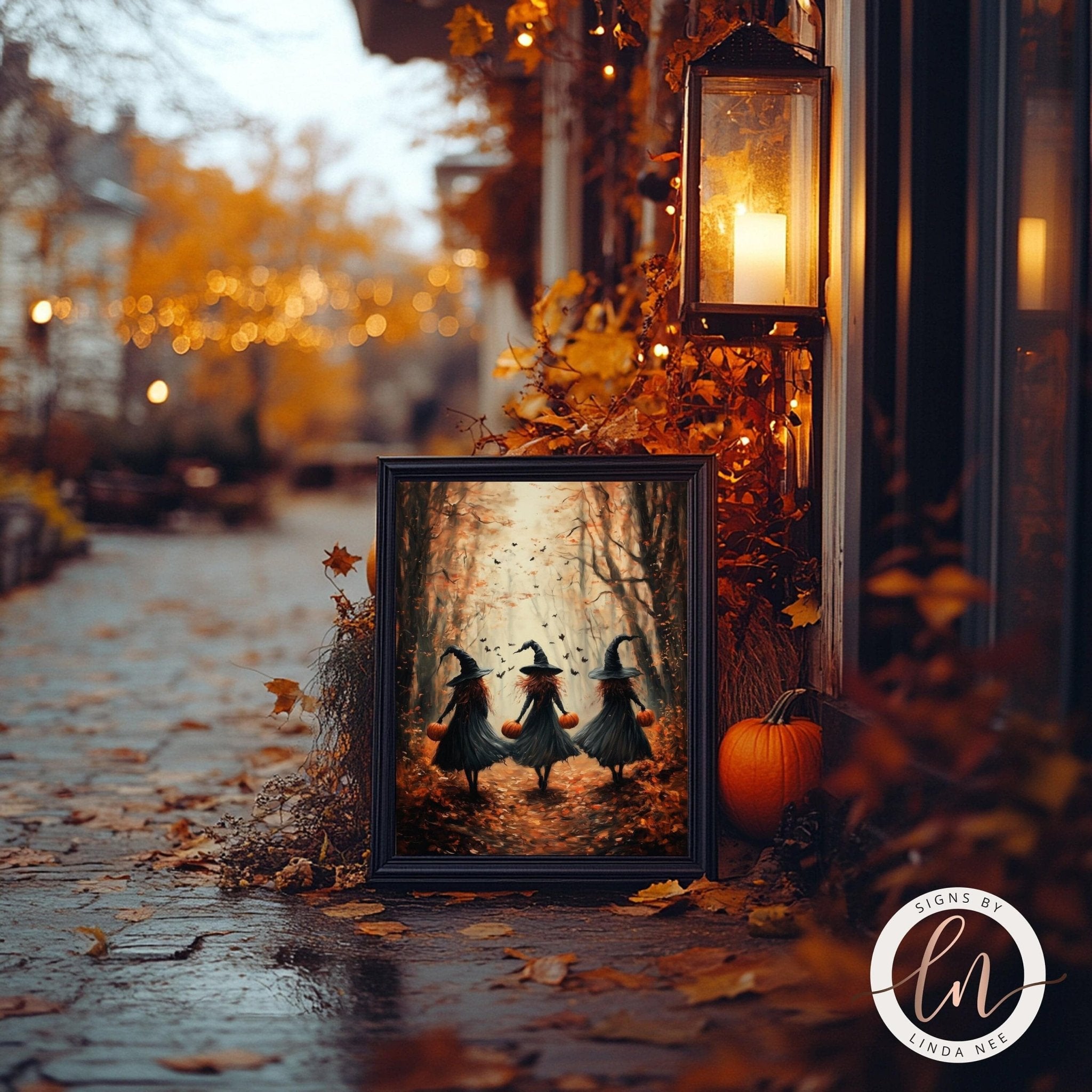 a Halloween-themed scene with three girls dressed as witches walking through a forest, surrounded by autumn leaves and a pumpkin.