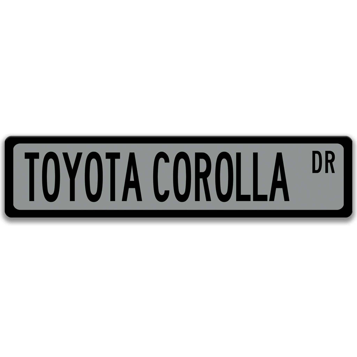 Gray Toyota Corolla street sign with black border and black text reading TOYOTA COROLLA DR