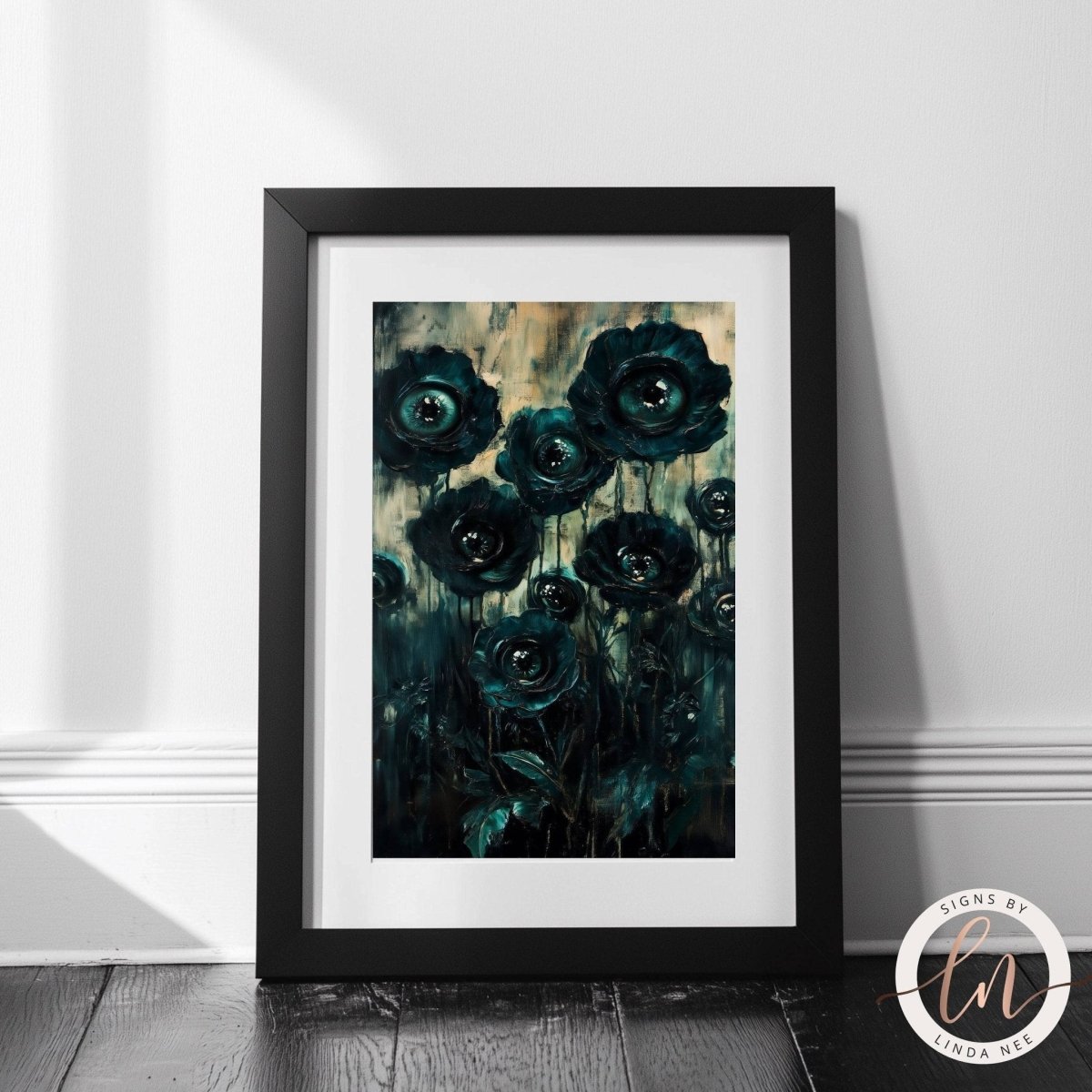 Framed artwork of dark green flowers with round watching eyes