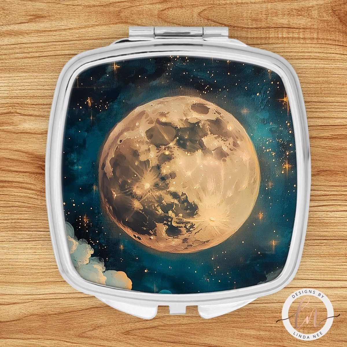 A compact mirror with a celestial scene of a large, glowing moon surrounded by stars and clouds against a dark blue background.