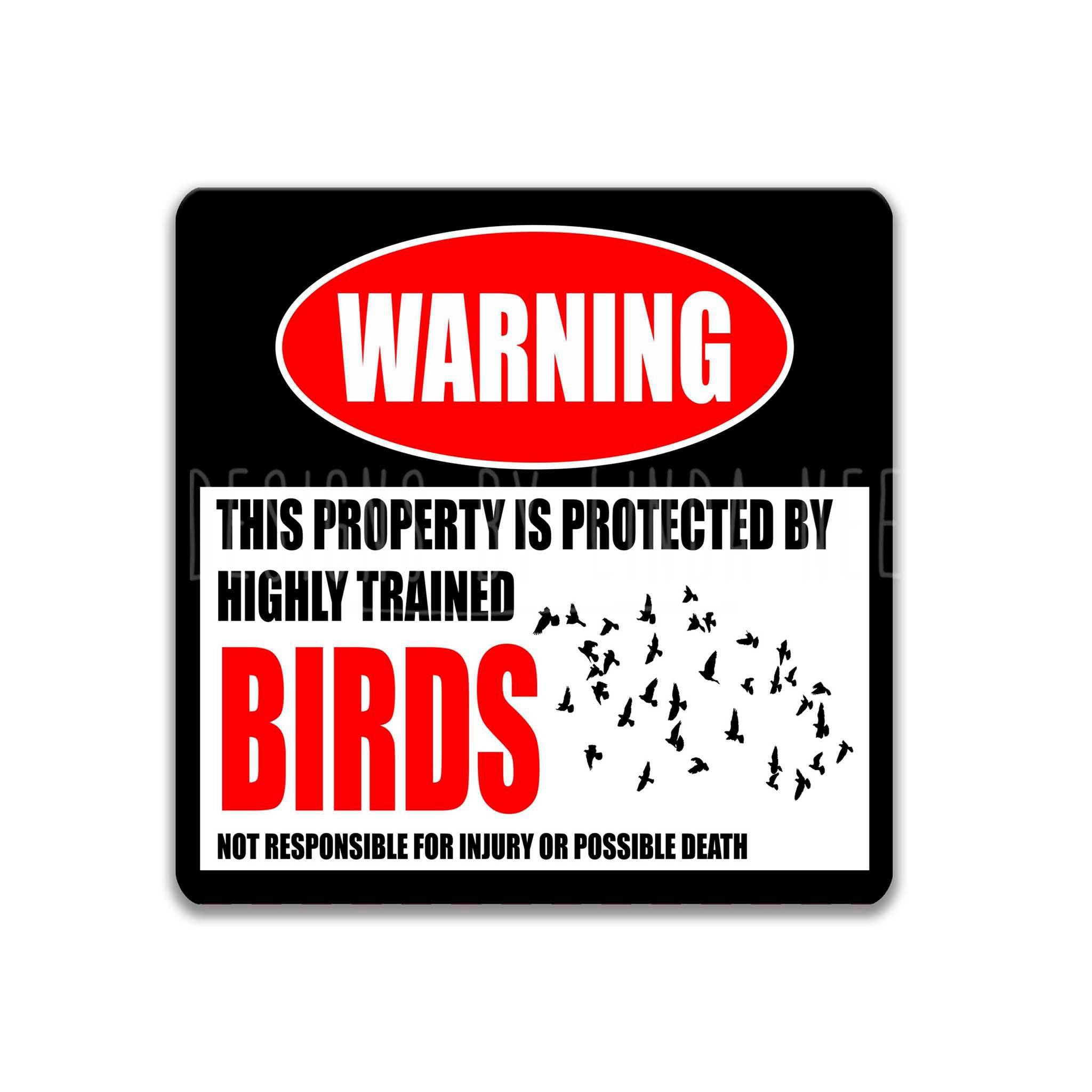 a warning sign that states "This property is protected by highly trained birds. Not responsible for injury or possible death."