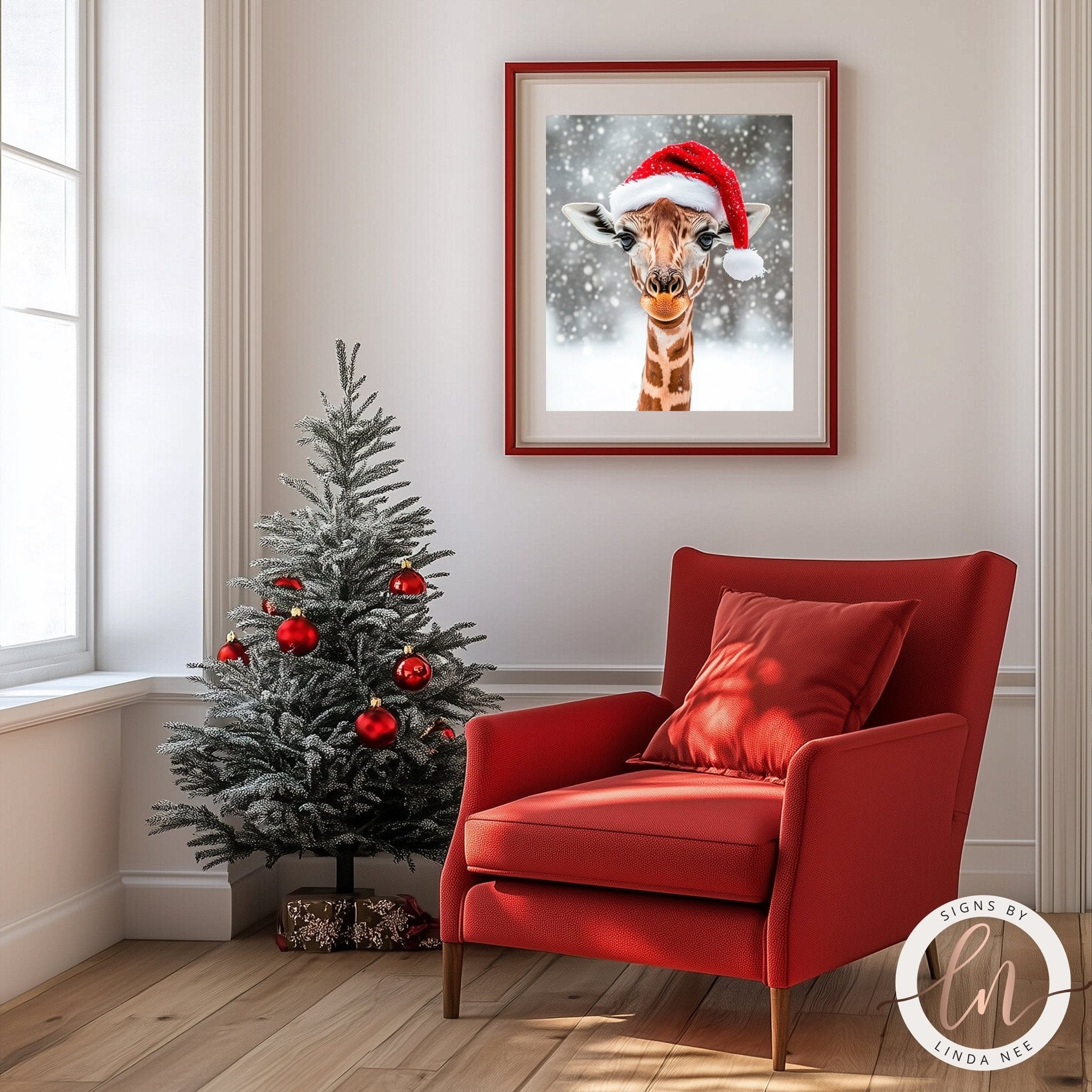 a cozy living room with a Christmas tree, a red armchair, and a framed picture of a giraffe wearing a Santa hat.