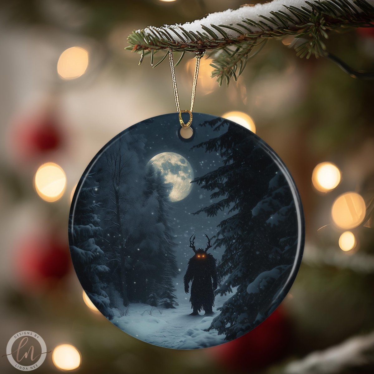 A round ornament hanging from a tree branch, depicting a snowy forest scene with a full moon in the background.