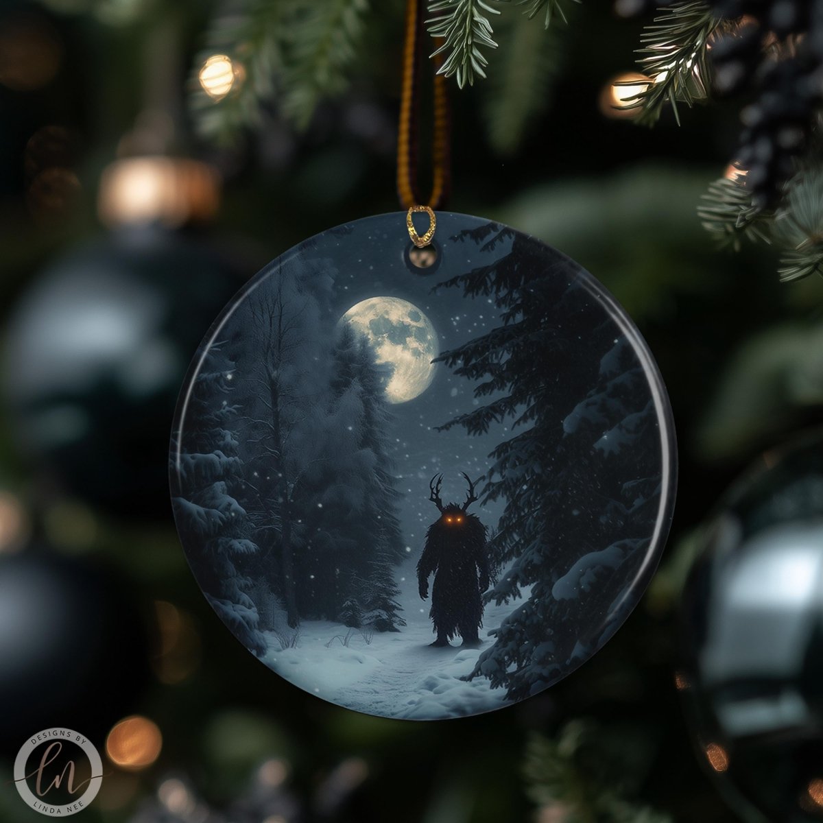 A round ornament hanging on a Christmas tree, depicting a dark figure with horns and glowing eyes standing in a snowy forest under a full moon.