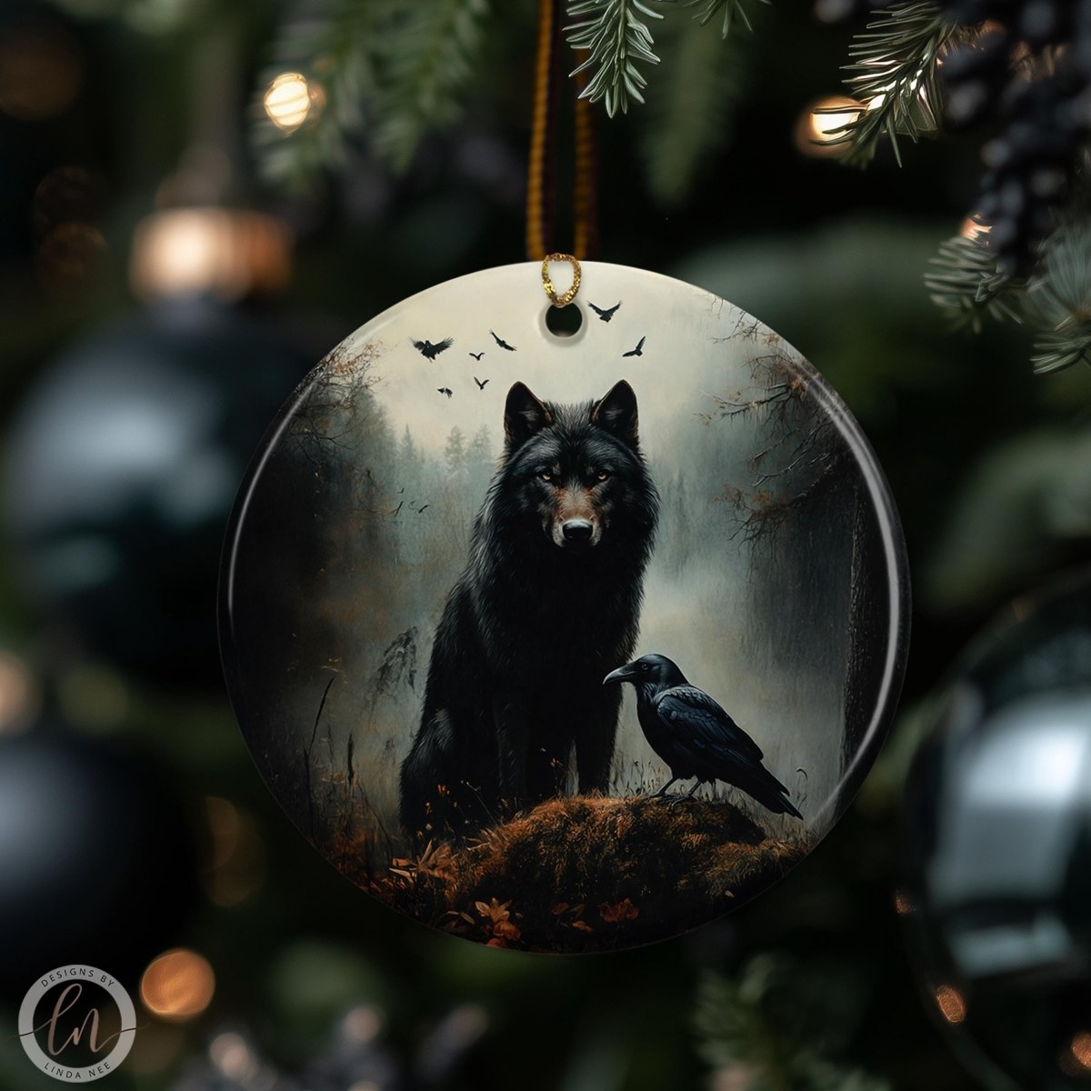 Gothic wolf and raven ceramic Christmas ornament hanging on a moody dark holiday tree