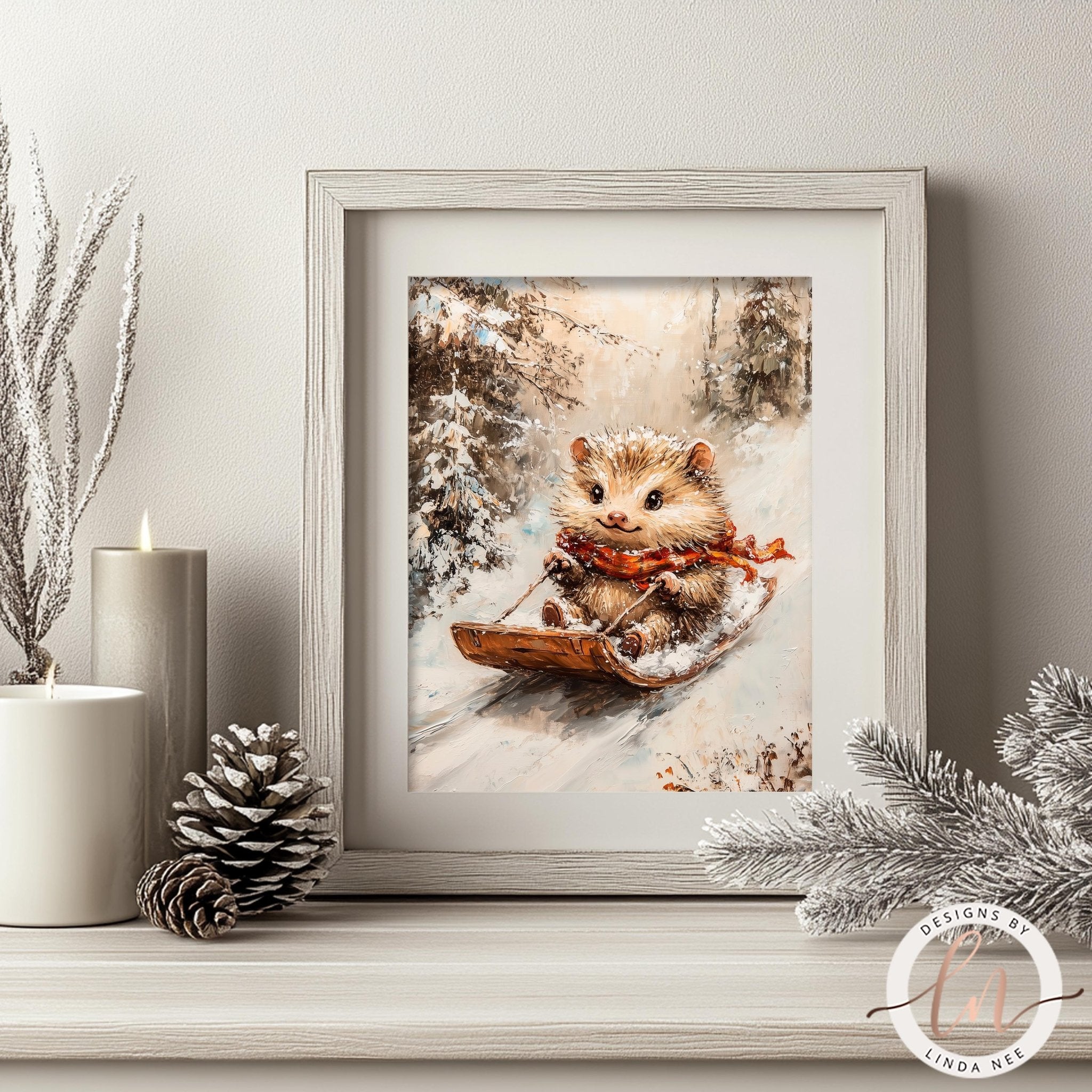 A framed painting of a hedgehog riding a sled in a snowy forest, with a pine cone and candles on a shelf in the foreground.