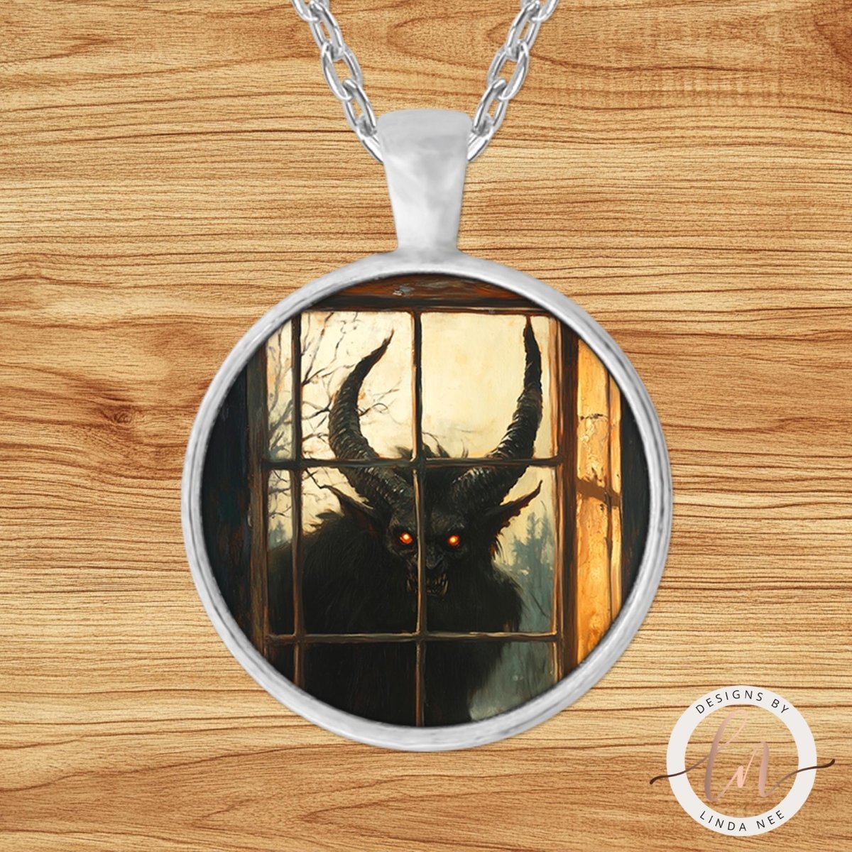 A pendant necklace with a circular design featuring a large, menacing-looking creature with horns and glowing red eyes, possibly a monster or a demon, peering through a window.