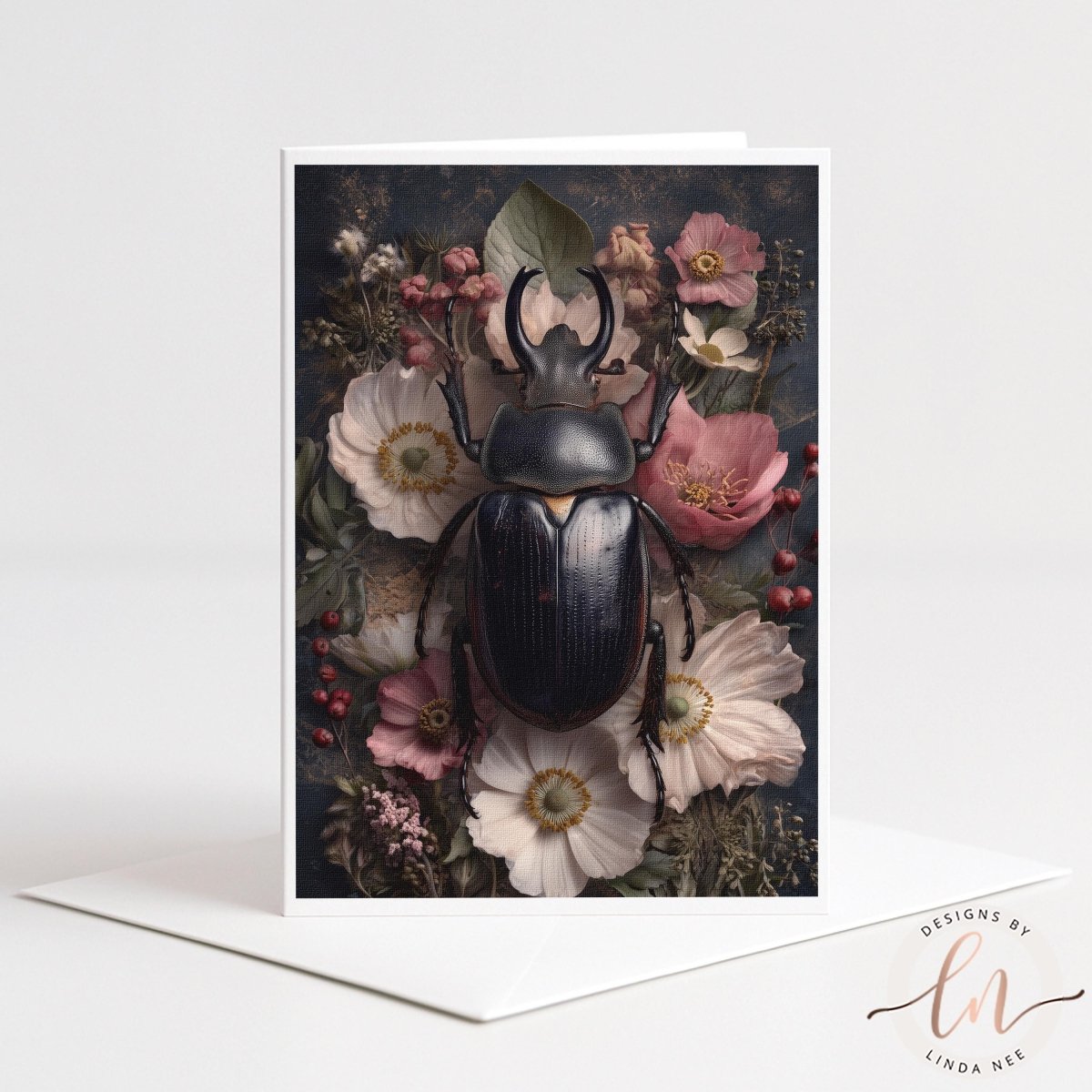 A close-up of a large black beetle surrounded by a variety of colorful flowers, including pink, white, and red blooms, against a dark background.