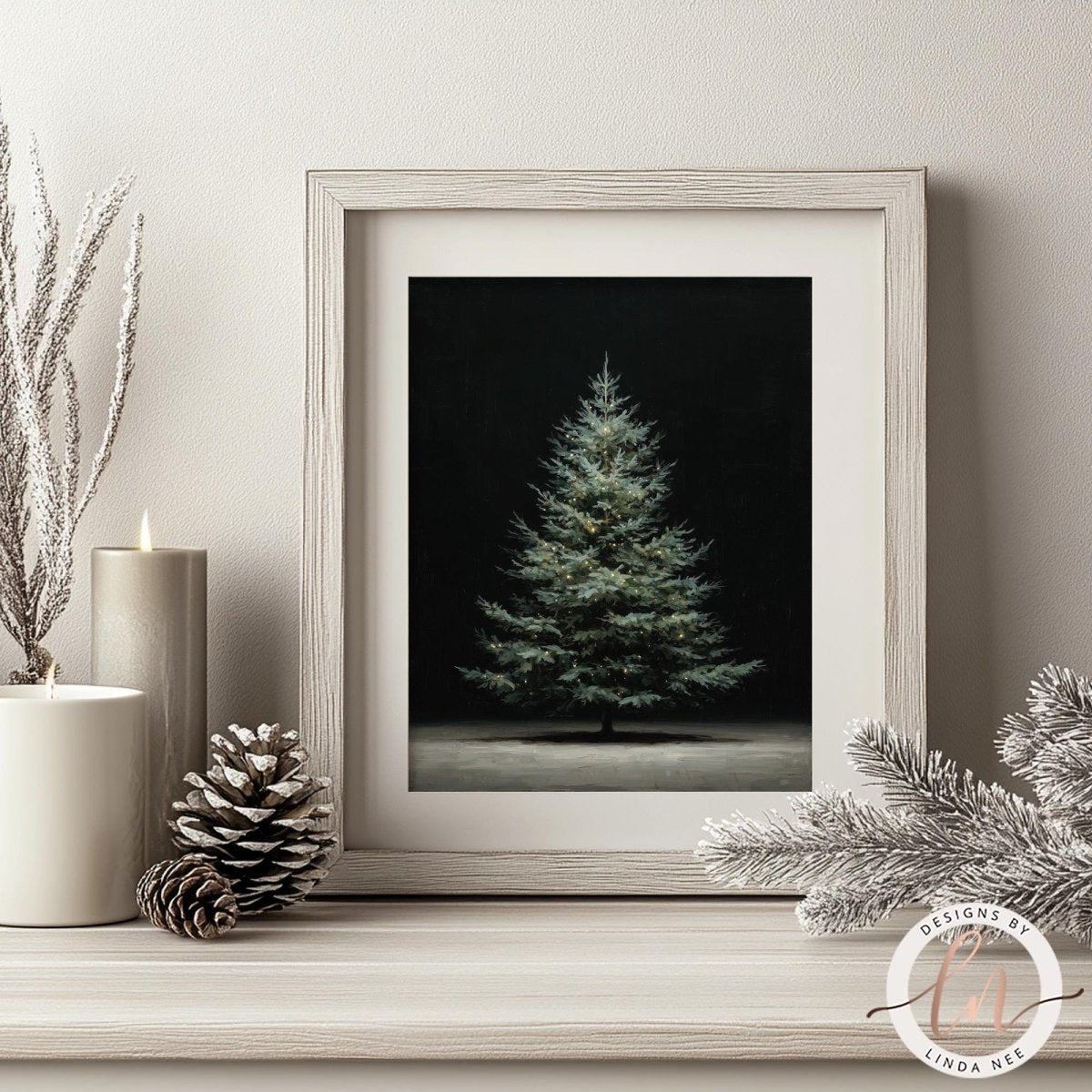a framed photograph of a single, lit Christmas tree against a dark background, placed on a shelf next to a lit candle and a pine cone.