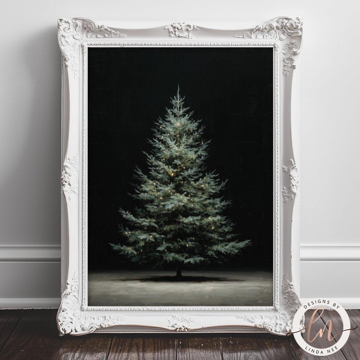 A white ornate picture frame containing a photograph of a single, lit Christmas tree against a dark background.