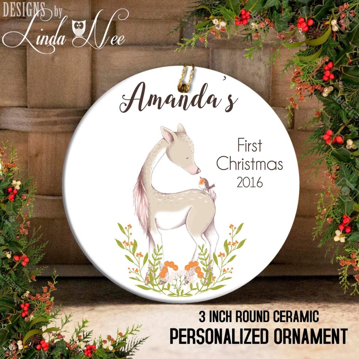 A round ceramic ornament with a deer and flowers, labeled "Amanda's First Christmas 2016" and "3 INCH ROUND CERAMIC PERSONALIZED ORNAMENT".