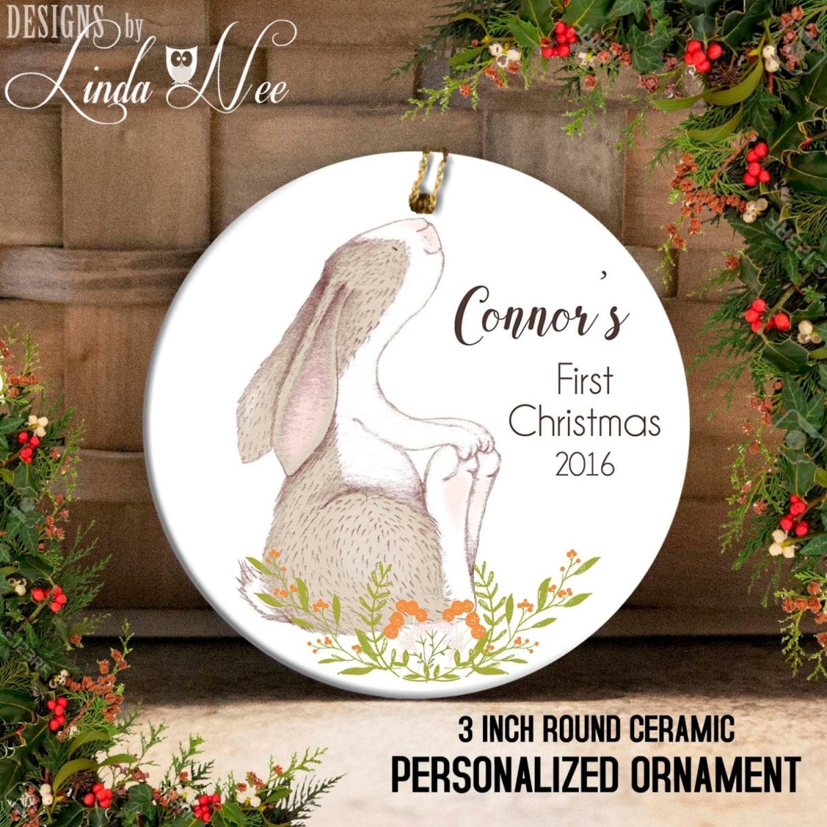 Round ceramic personalized ornament with a rabbit design and text, surrounded by festive decorations.
