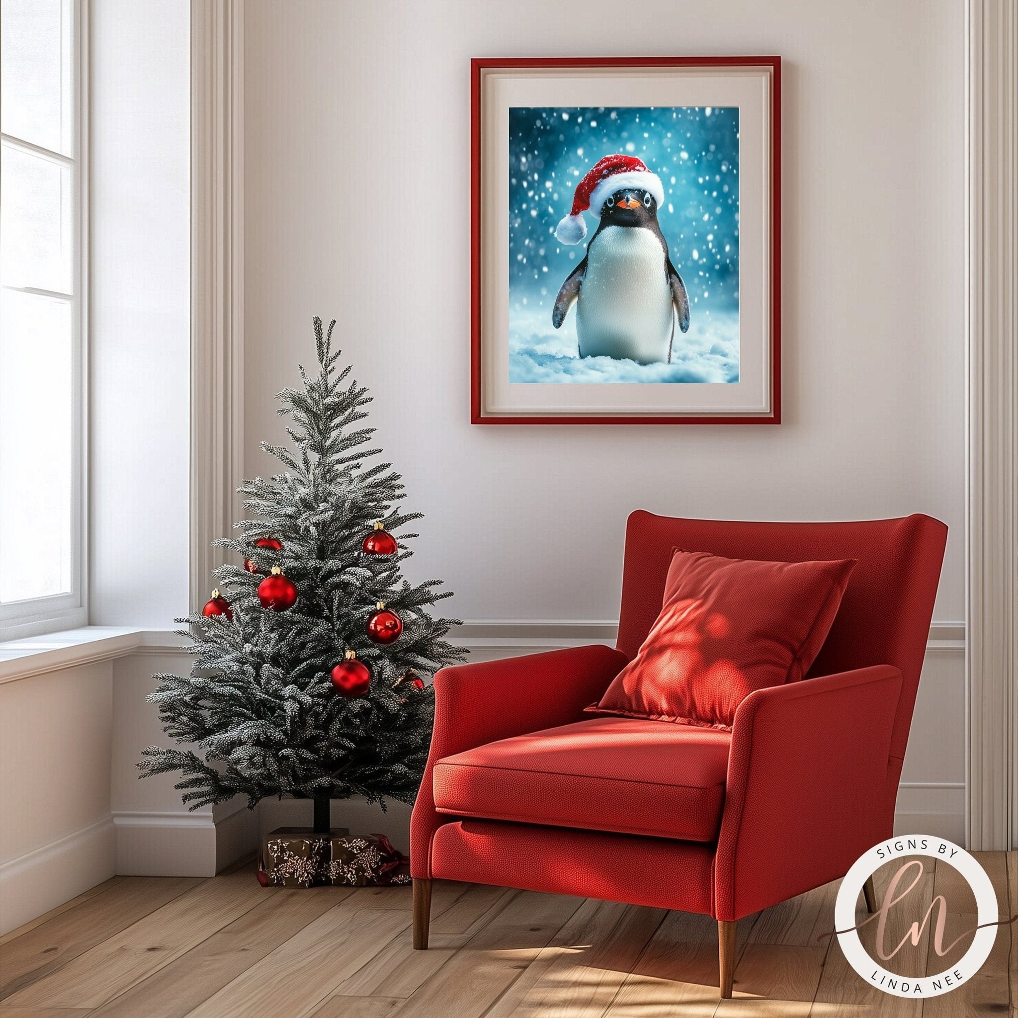 a cozy living room with a Christmas tree, a red armchair, and a framed picture of a penguin wearing a Santa hat.