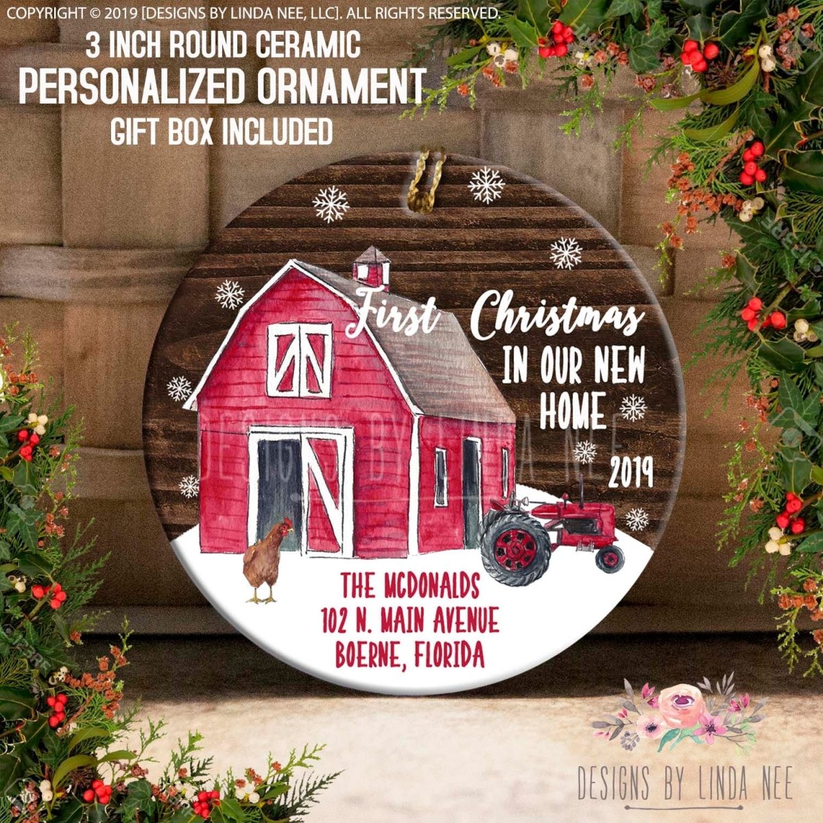 Round ceramic personalized ornament with a red barn, tractor, and text 'First Christmas in Our New Home 2019' on a wooden background.