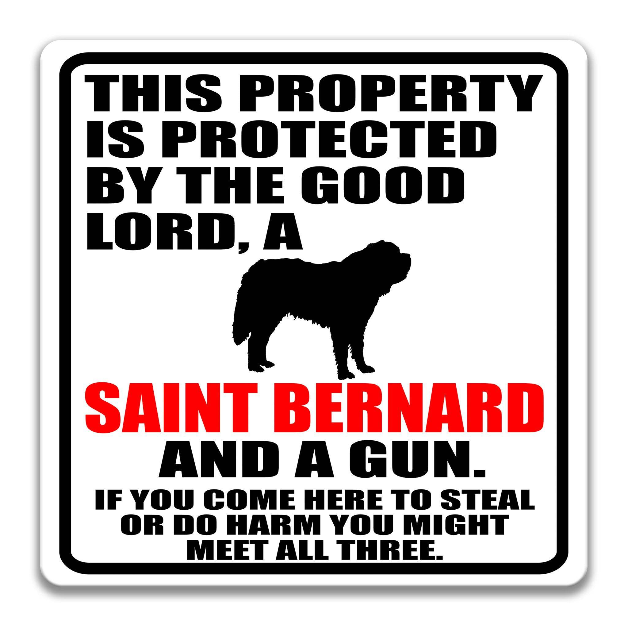 Property Protected by the Good Lord, a Saint Bernard, and a Gun Dog Sign
