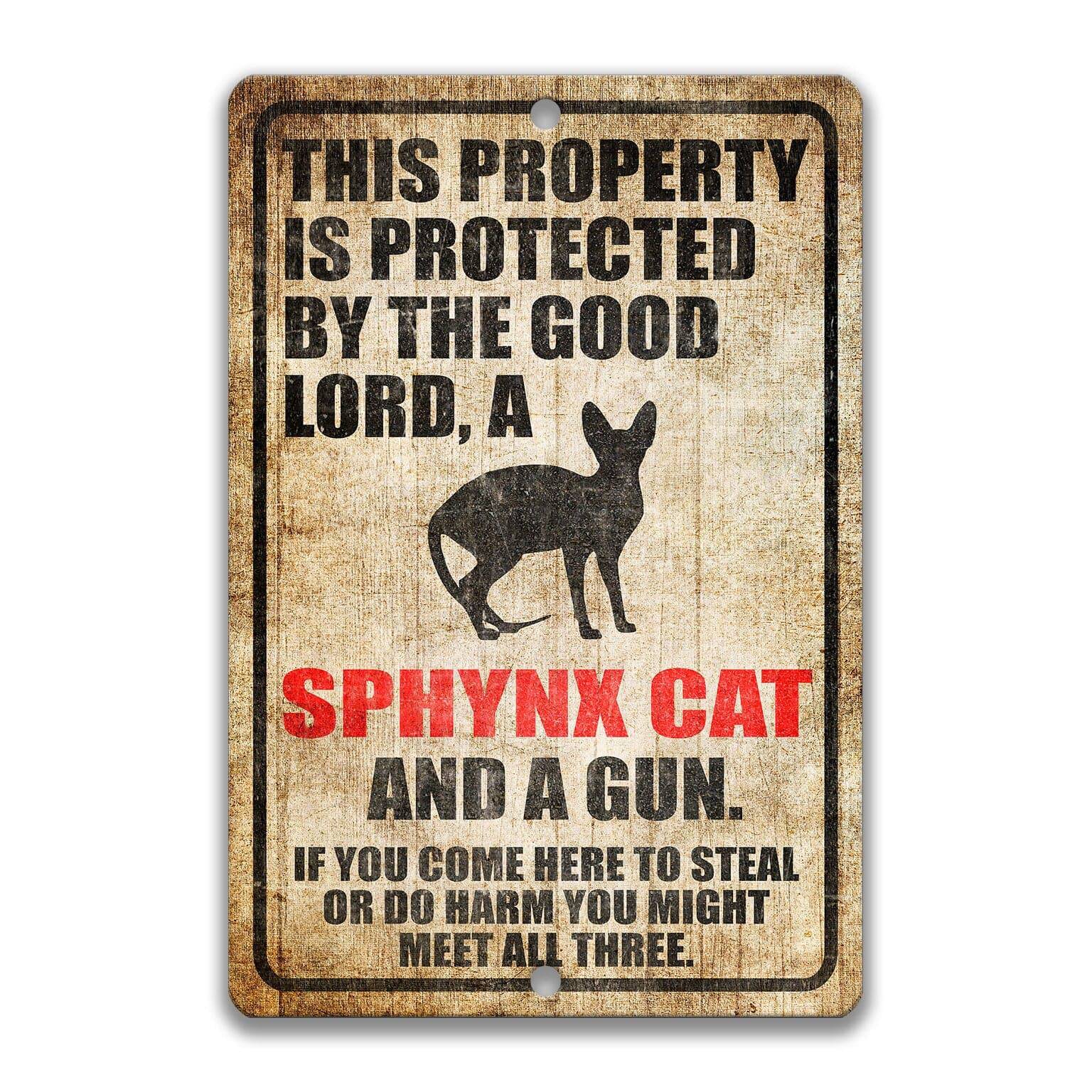 Property Protected by the Good Lord, a Sphynx Cat, and a Gun Cat Sign