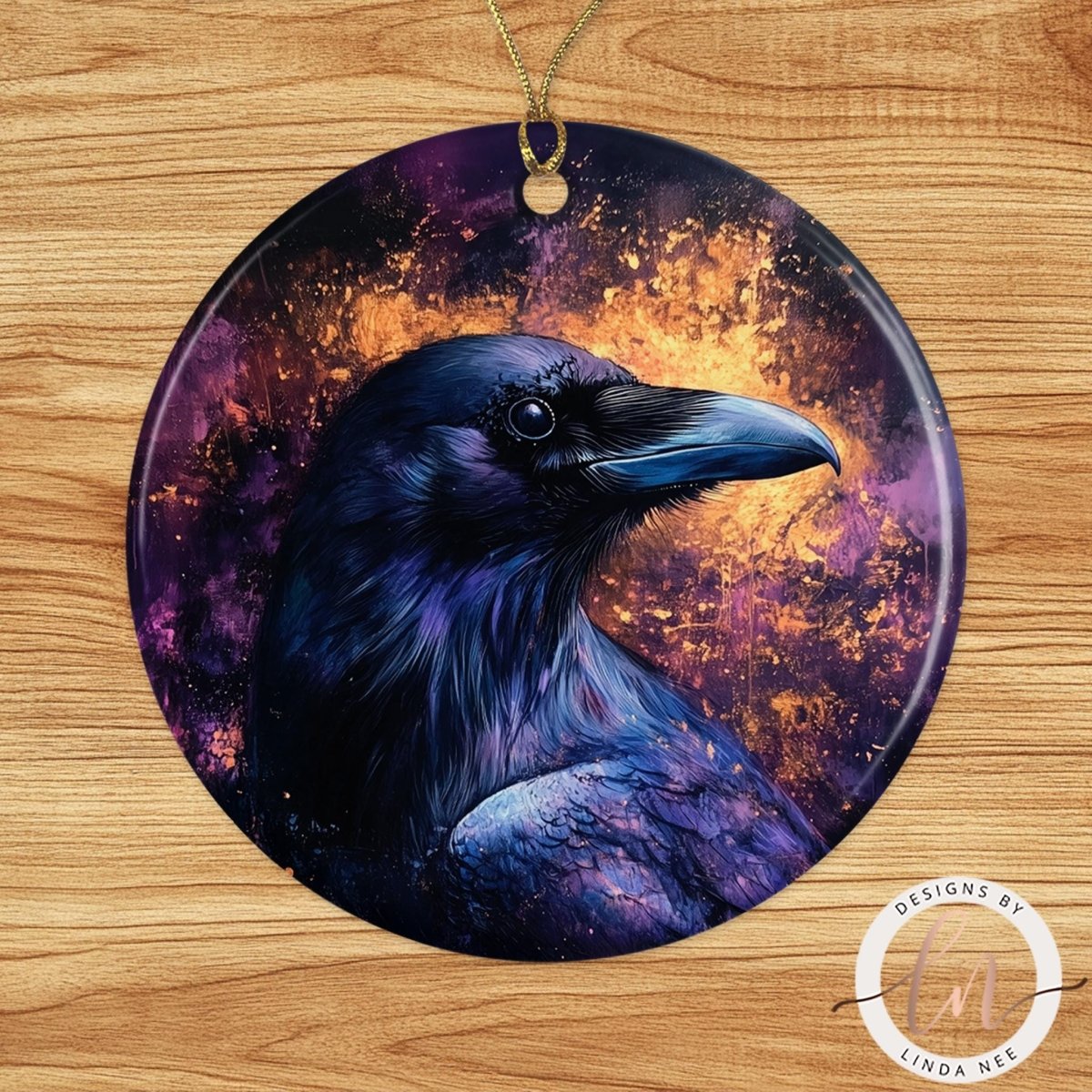 3 inch ceramic moon ornament with night sky artwork and gold cord on wood background