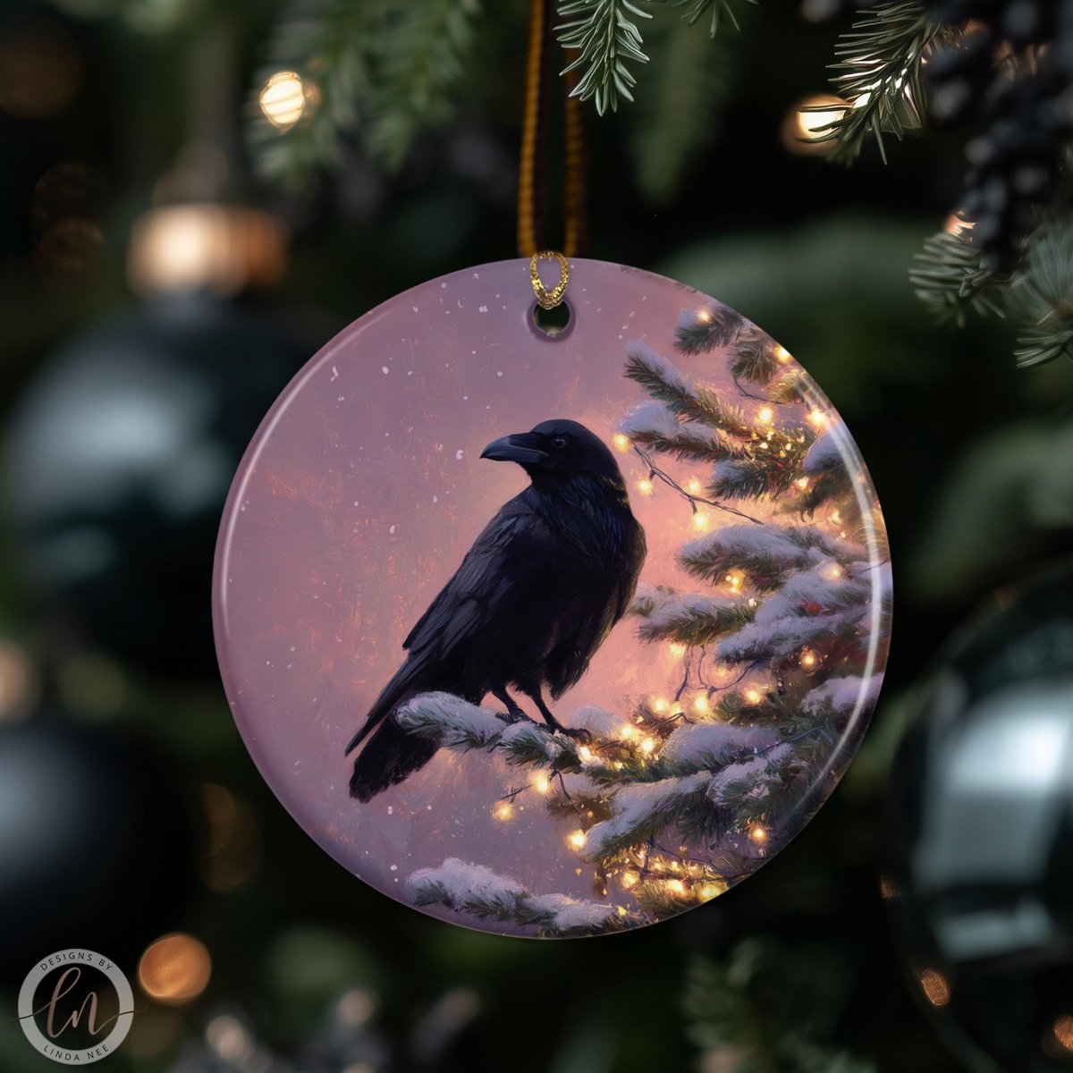 A black bird is perched on a snowy branch of a Christmas tree, with twinkling lights illuminating the scene.