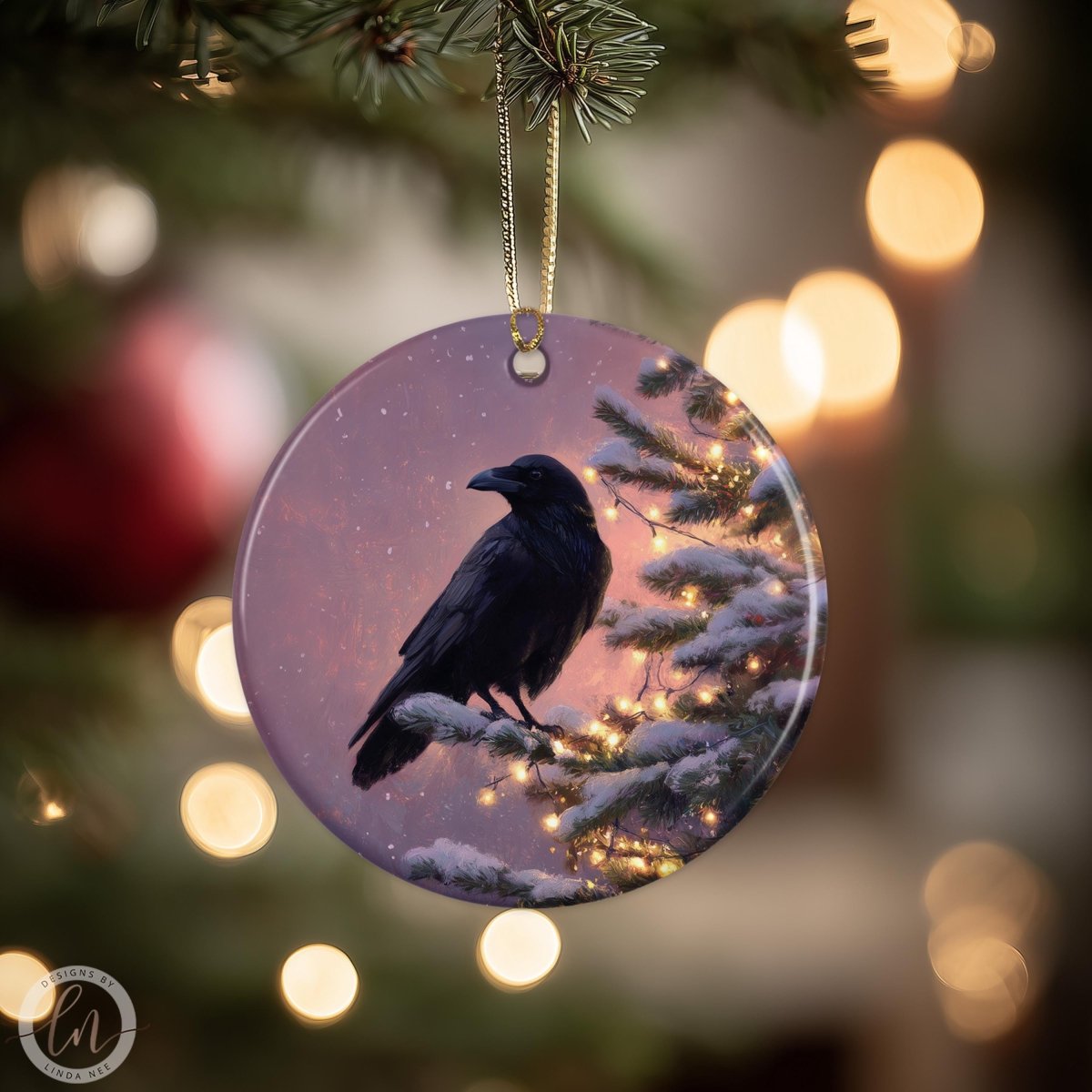A black bird is perched on a snowy branch, with a purple and pink background, and Christmas lights in the background.