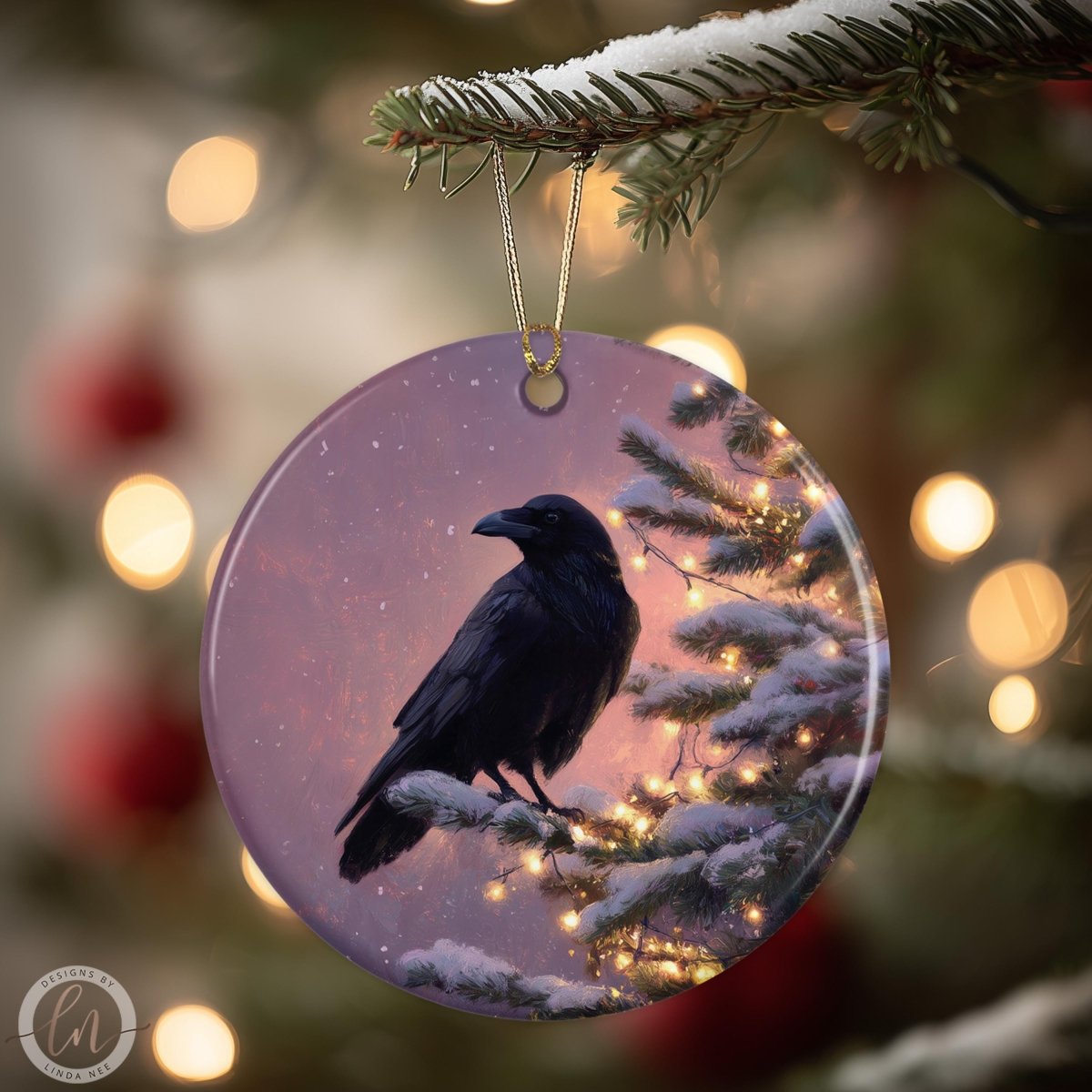 A black bird is perched on a snowy branch of a Christmas tree, with twinkling lights and a purple background.