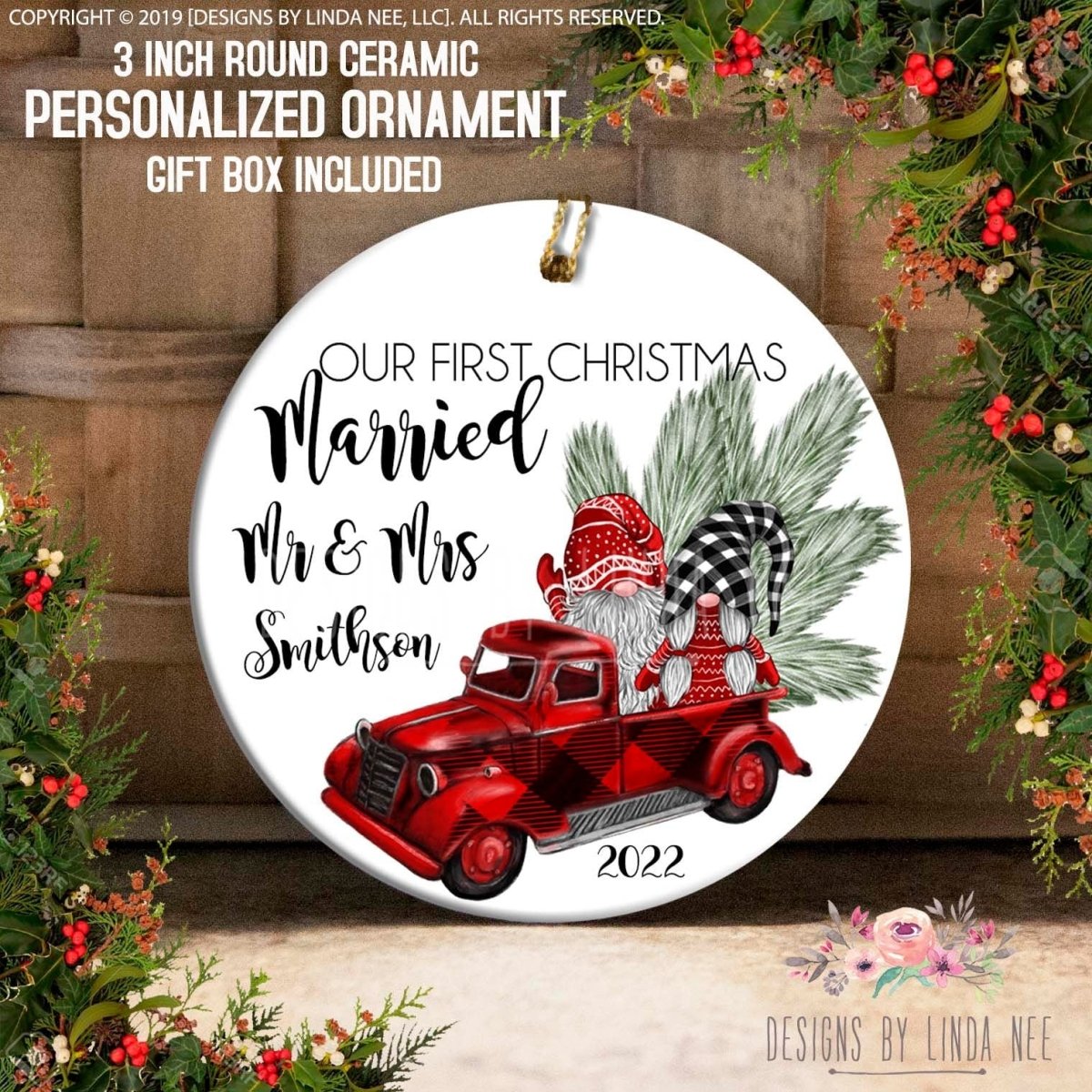 Round ceramic personalized ornament with gnomes on a red truck, surrounded by Christmas decorations.